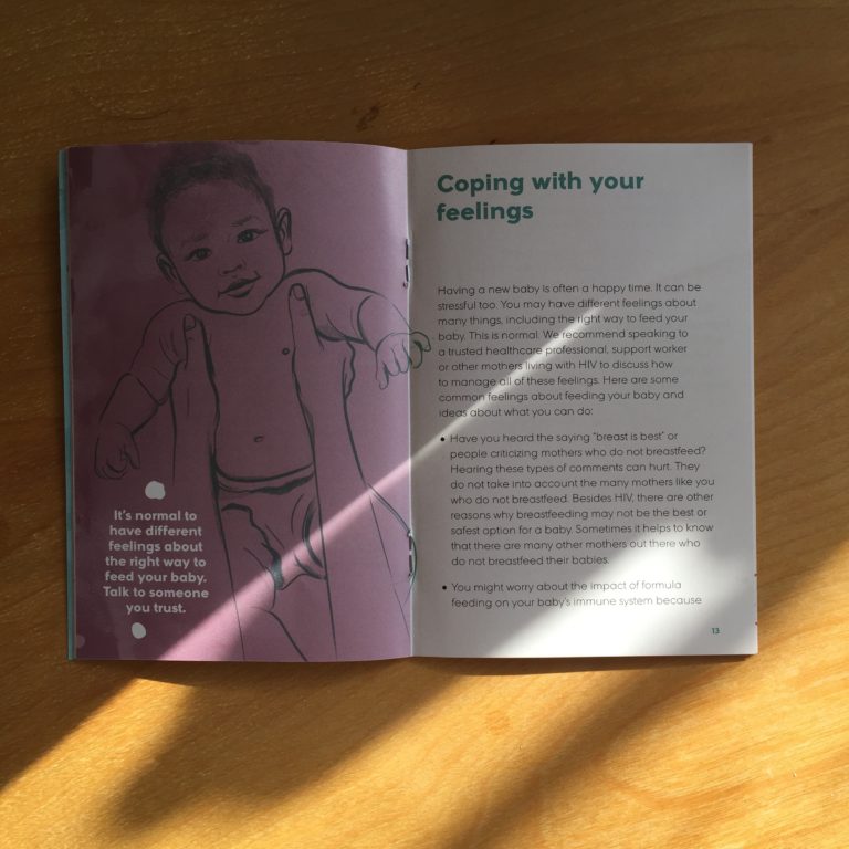 Photo: Two-page spread from “Is Formula Good for my Baby?” — an infant feeding resource for HIV positive mothers. The right side of the spread is filled with text. The left side is an illustration of a baby being held up by an adult. Only the arms of the adult are visible. On the illustration is large text reading “It’s normal to have different feelings about the right way to feed your baby. Talk to someone you trust.”